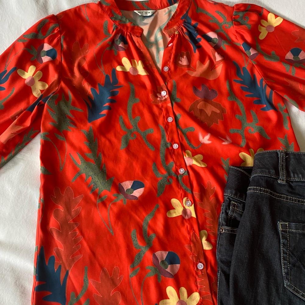 Bright fun blouse size s runs large.